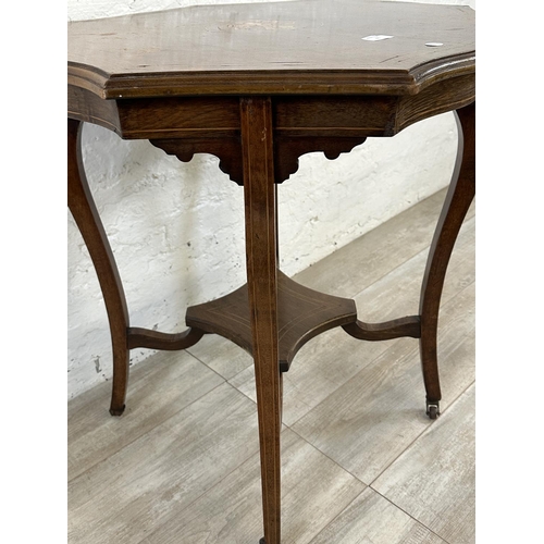 61 - A late 19th/early 20th century inlaid rosewood serpentine octagonal two tier side table - approx. 74... 