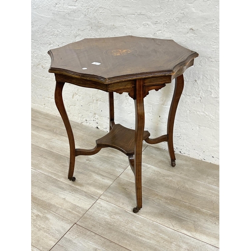 61 - A late 19th/early 20th century inlaid rosewood serpentine octagonal two tier side table - approx. 74... 