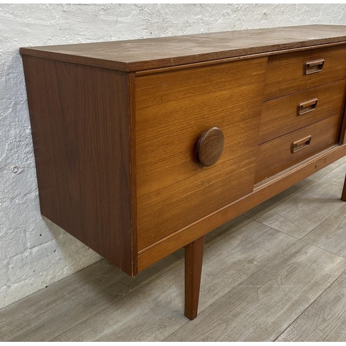 69 - A mid 20th century teak sideboard - approx. 72cm high x 154cm wide x 40cm deep