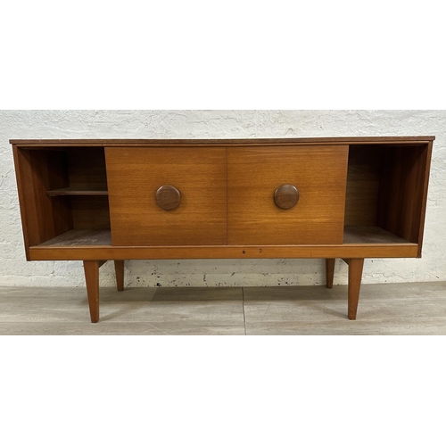 69 - A mid 20th century teak sideboard - approx. 72cm high x 154cm wide x 40cm deep