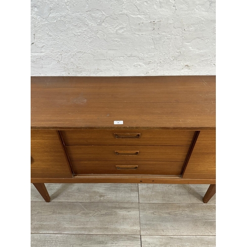 69 - A mid 20th century teak sideboard - approx. 72cm high x 154cm wide x 40cm deep