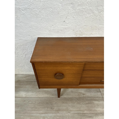 69 - A mid 20th century teak sideboard - approx. 72cm high x 154cm wide x 40cm deep