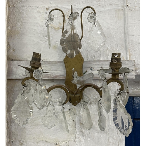 7 - Three Rococo style gilt metal wall sconces with crystal droplets