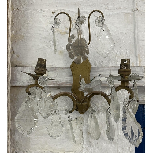 7 - Three Rococo style gilt metal wall sconces with crystal droplets