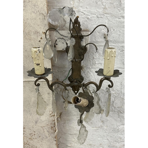 7 - Three Rococo style gilt metal wall sconces with crystal droplets