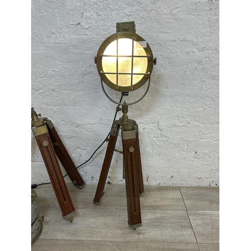 71 - A pair of industrial style wood and brass effect spotlight tripod floor lamps - approx. 90cm high