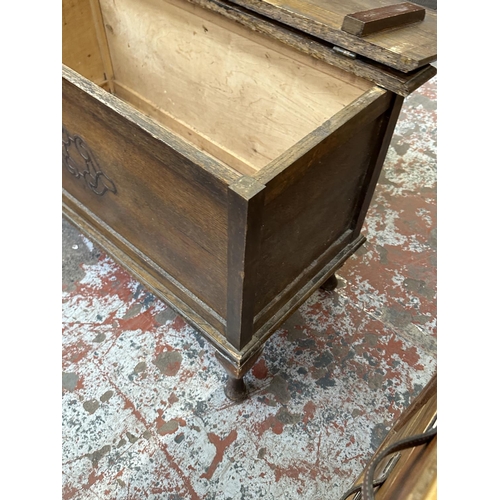 76 - A 1930s carved oak blanket box - approx. 57cm high x 91cm wide x 43cm deep