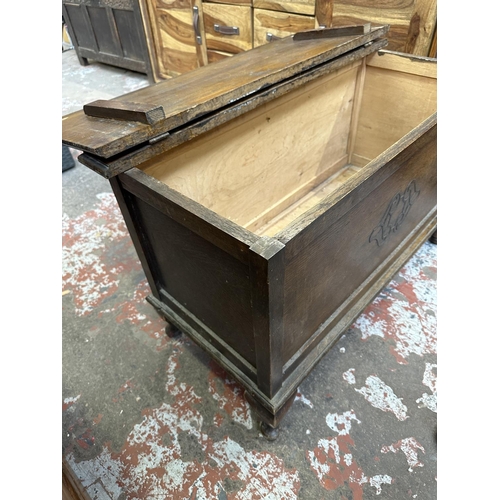 76 - A 1930s carved oak blanket box - approx. 57cm high x 91cm wide x 43cm deep