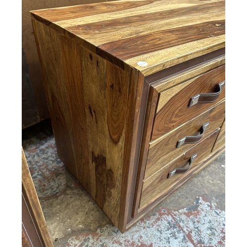 77 - An Indian sheesham wood chest of drawers - approx. 66cm high x 145cm wide x 45.5cm deep