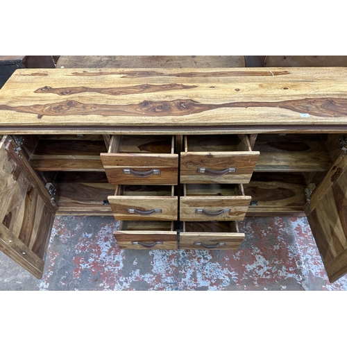 78 - An Indian sheesham wood sideboard - approx. 82cm high x 175cm wide x 45cm deep