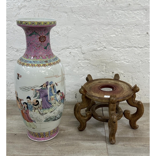 8 - A Chinese Famille Rose hand painted porcelain vase on carved hardwood stand - vase approx. 63cm high... 