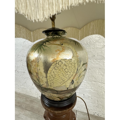 9 - Two items, one Oriental style hand painted ceramic table lamp with bird design and wooden stand and ... 