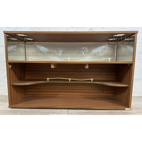 90 - A mid 20th century teak effect and black vinyl drinks cabinet - approx. 65cm high x 107cm wide x 36c... 