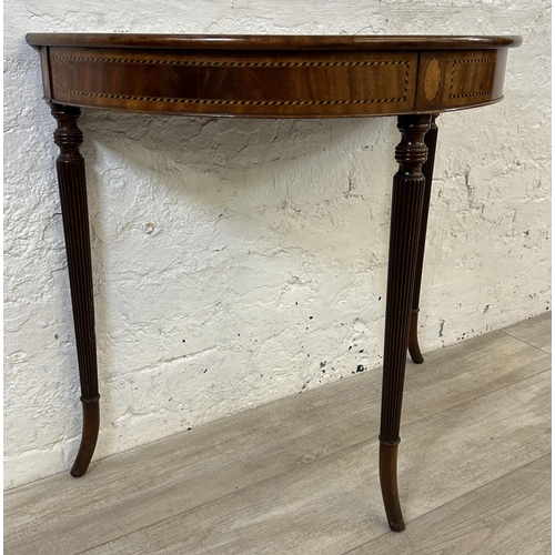 92 - A 19th century inlaid mahogany demi lune console table on fluted supports - approx. 71cm high x 79cm... 