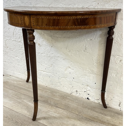 92 - A 19th century inlaid mahogany demi lune console table on fluted supports - approx. 71cm high x 79cm... 