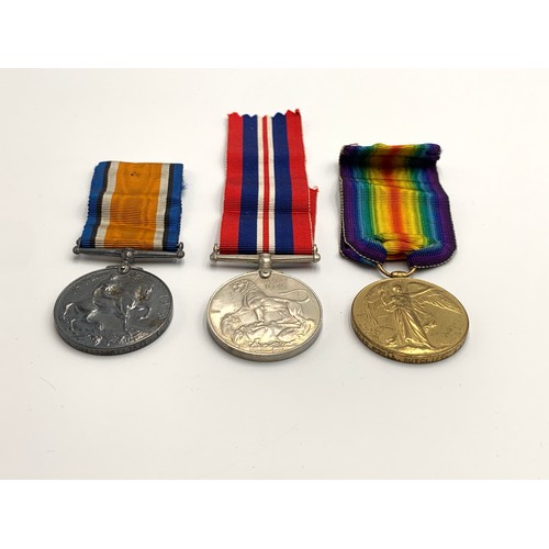 2373 - Three British military medals, one WWI pair presented to 48061 Pte. L. Sutclife. S. LAN. R. and one ... 