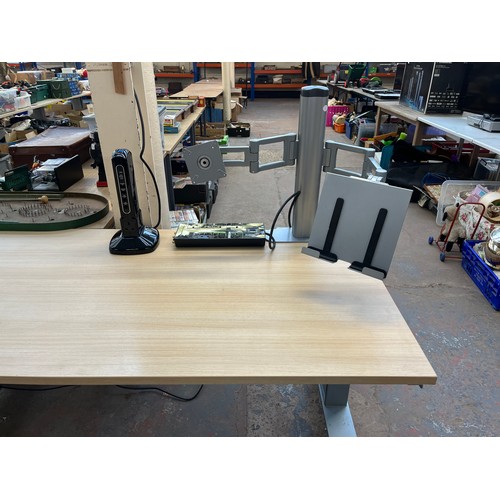 100A - Three items, one modern oak effect and grey metal electric office desk, one Monster GreenPower HDP 7... 