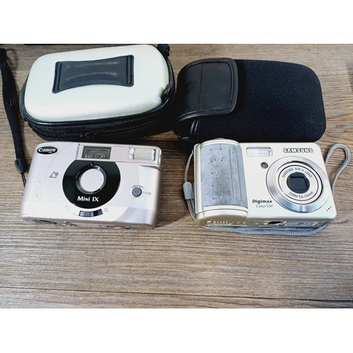 701 - Eight items to include cased Kyocera Yashica DF-10 compact 35mm camera, cased Samsung Digimax Cyber ... 