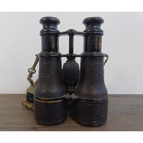 696 - A pair of French Colmont binoculars with broad arrow mark