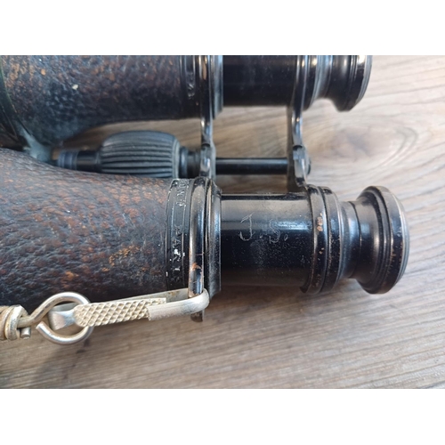 696 - A pair of French Colmont binoculars with broad arrow mark