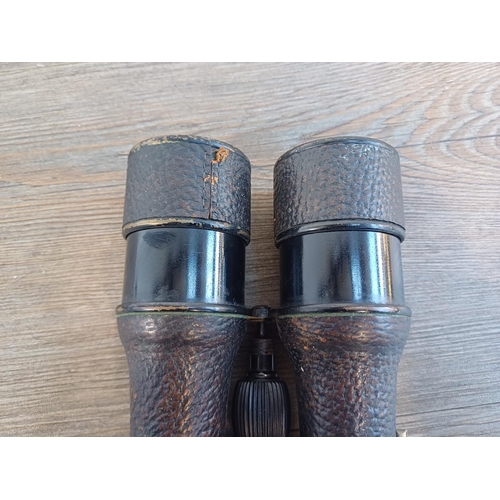 696 - A pair of French Colmont binoculars with broad arrow mark