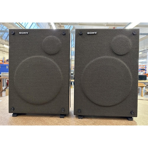 749 - A pair of Sony speakers with built-in speaker cables