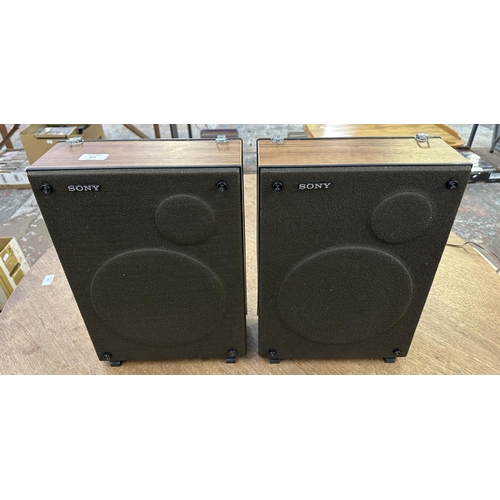 749 - A pair of Sony speakers with built-in speaker cables