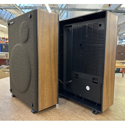 749 - A pair of Sony speakers with built-in speaker cables