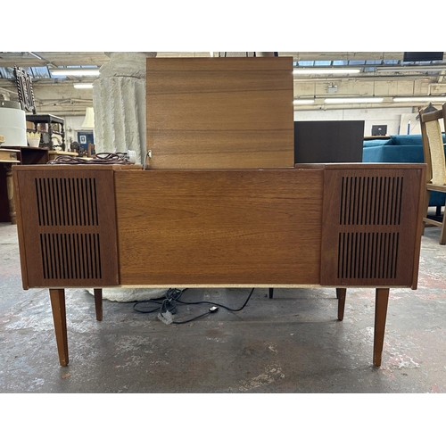 754 - A Ferguson 3334 solid state radiogram comprising four-speed autochanger turntable and three-band rec... 