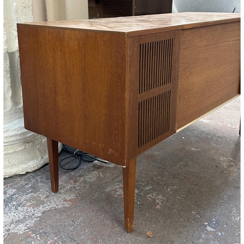 754 - A Ferguson 3334 solid state radiogram comprising four-speed autochanger turntable and three-band rec... 