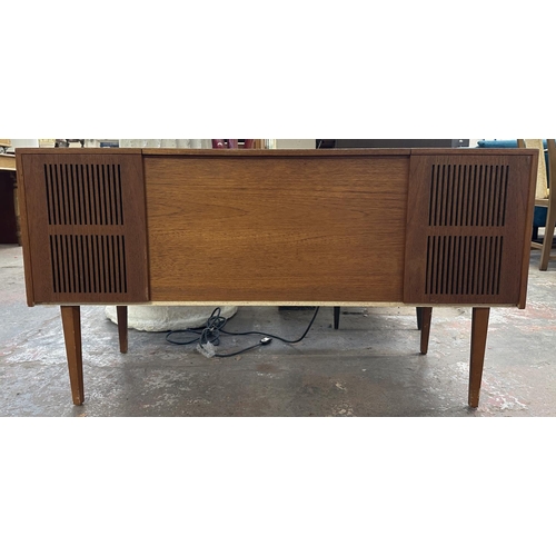 754 - A Ferguson 3334 solid state radiogram comprising four-speed autochanger turntable and three-band rec... 