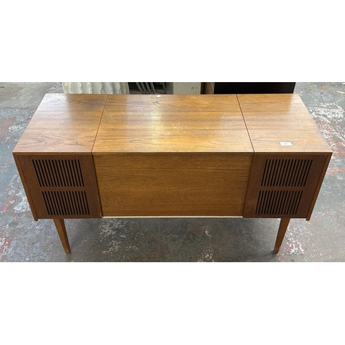 754 - A Ferguson 3334 solid state radiogram comprising four-speed autochanger turntable and three-band rec... 