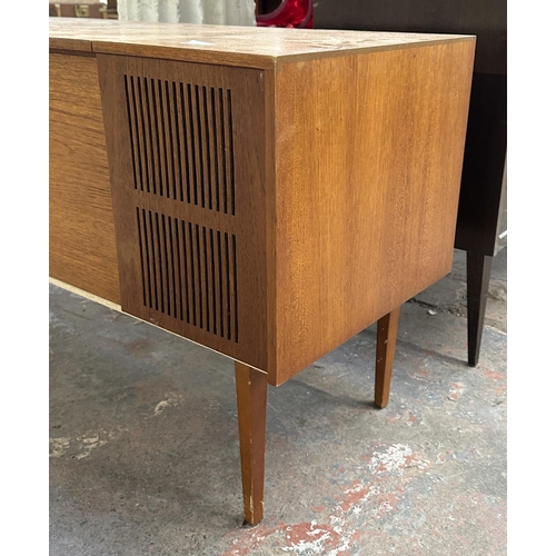 754 - A Ferguson 3334 solid state radiogram comprising four-speed autochanger turntable and three-band rec... 