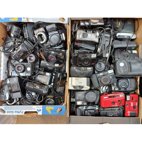 722 - Two boxes containing a large collection of cameras for spares or repair to include Pentax, Minolta, ... 