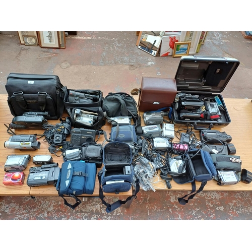 725 - A large collection of camcorders to include Canon, Panasonic, JVC, Sony etc.