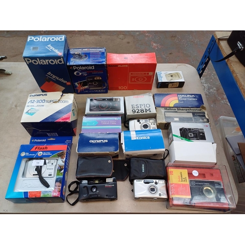 728 - A collection of boxed cameras to include Olympus AZ-3000 Superzoom, Konica Z-UP80E, Olympus Trip AFS... 