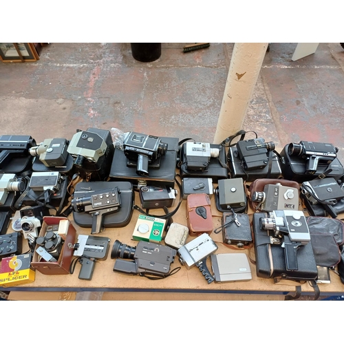 729 - A collection of cine cameras to include Bauer, Yashica, Sekonic, Bell & Howell etc.