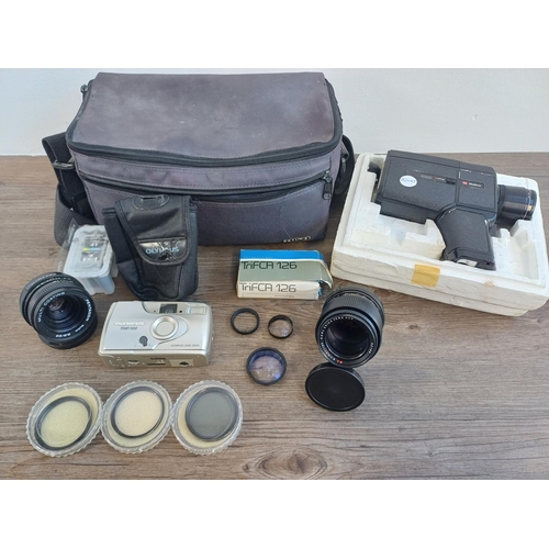 671 - A Praktica camera bag containing Olympus Trip 500 compact 35mm camera, Carl Zeiss MC S 1:3.5 f=135mm... 