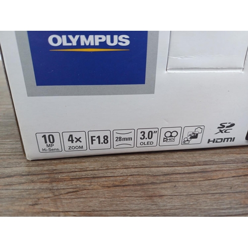 694 - A boxed and cased Olympus XZ-1 10mp CCD sensor compact digital camera with cables and instruction ma... 