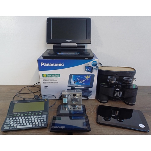 703 - Seven items, one boxed Panasonic DVD-LS83 portable DVD player with accessories and instruction manua... 