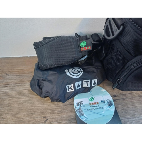 704 - A Kata camera bag containing Olympus OM-1N MD 35mm SLR camera fitted with Zuiko MC Auto-S 1:1.8 50mm... 