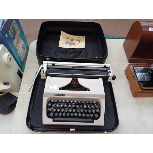 736 - A cased Robotron Erika portable typewriter