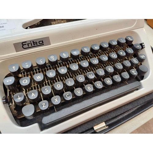 736 - A cased Robotron Erika portable typewriter