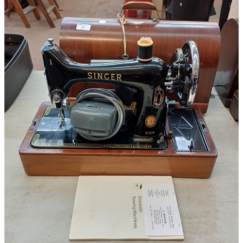 737 - A cased 1955 Singer 99K electric sewing machine with foot pedal, fitted light, accessories and key