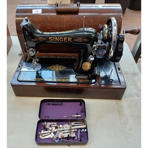 738 - A cased 1939 Singer 99K hand crank sewing machine with boxed attachments, accessories and key