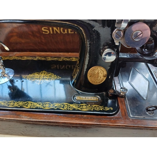 738 - A cased 1939 Singer 99K hand crank sewing machine with boxed attachments, accessories and key