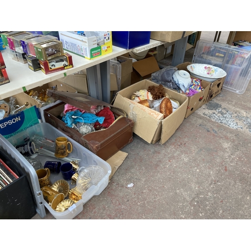 999 - Four boxes and one suitcases containing porcelain headed dolls, glass ships decanter, ceramic steins... 