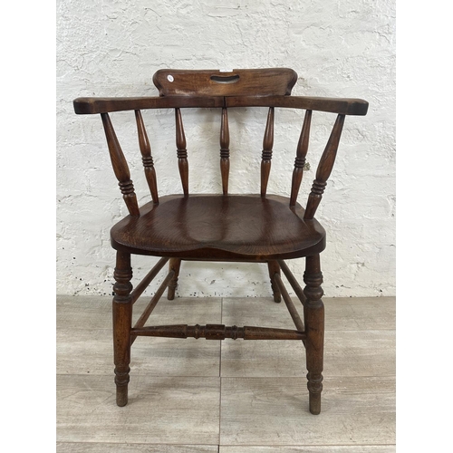 1 - A Victorian elm and beech smoker's bow chair, stamped to base Price & Wilding Makers Nantwich and im... 