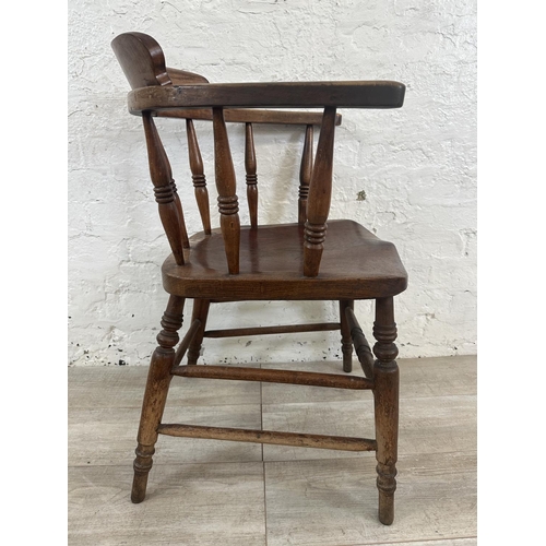 1 - A Victorian elm and beech smoker's bow chair, stamped to base Price & Wilding Makers Nantwich and im... 