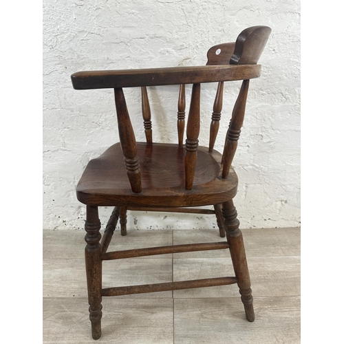 1 - A Victorian elm and beech smoker's bow chair, stamped to base Price & Wilding Makers Nantwich and im... 